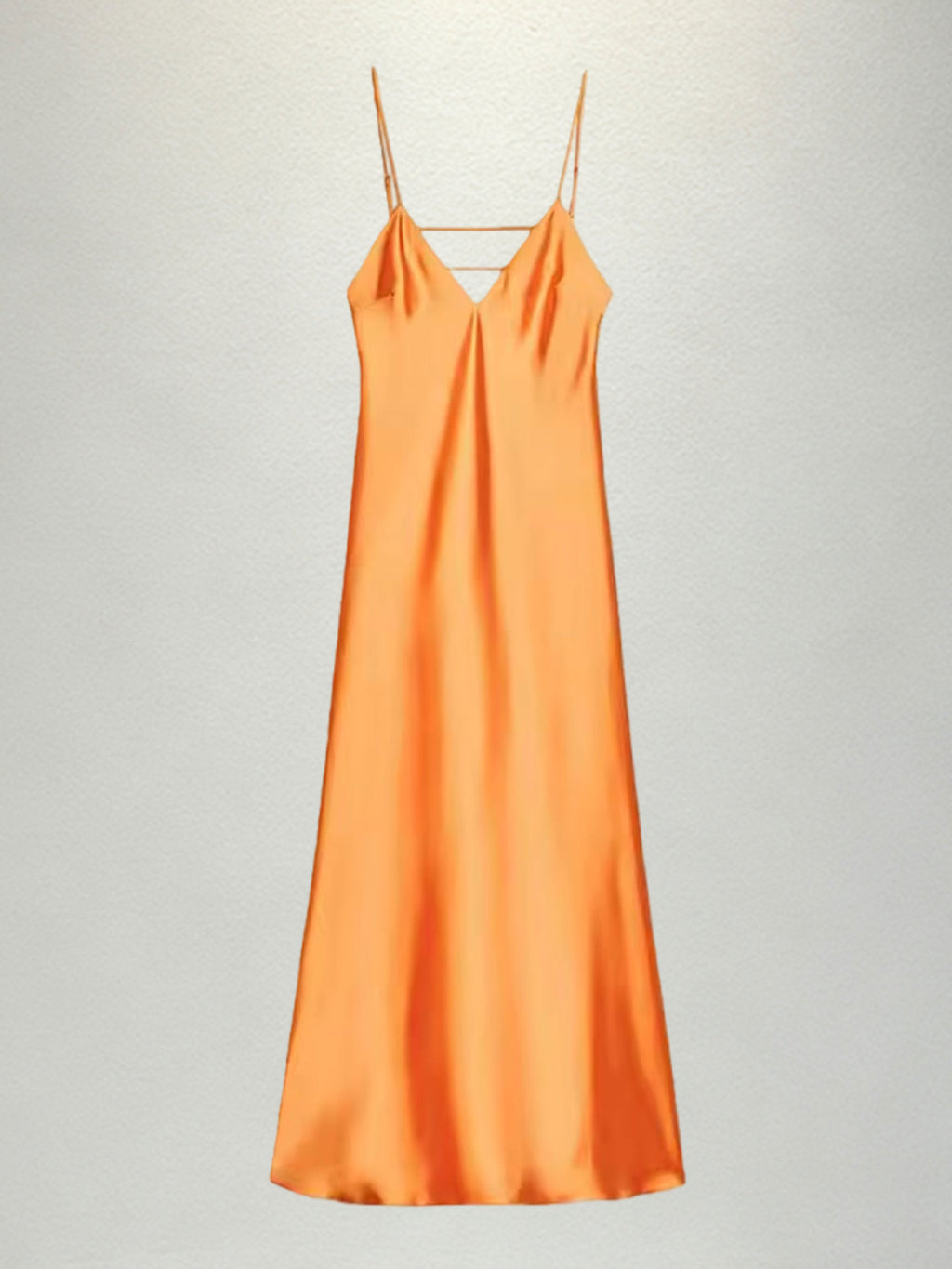 New French-style summer fresh satin slip dress with delicate spaghetti straps and a deep V-neck for an elegant look