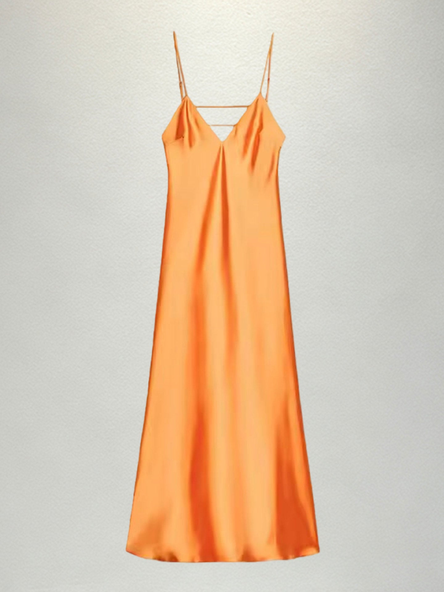 New French-style summer fresh satin slip dress with delicate spaghetti straps and a deep V-neck for an elegant look
